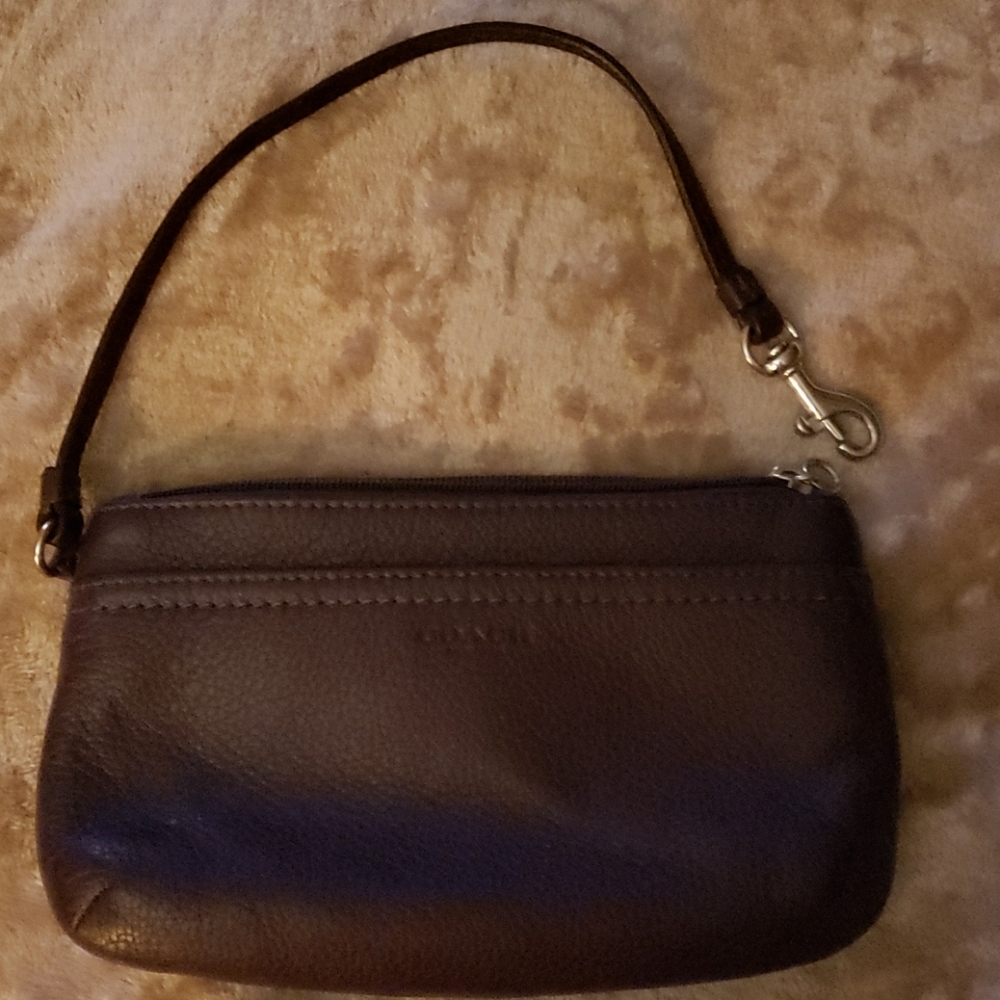 Coach 8x5 inch plum wristlet.